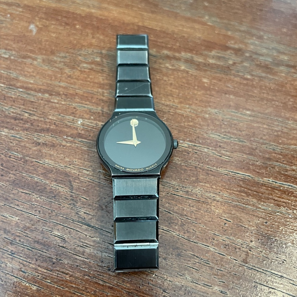 Women’s black metal movado watch